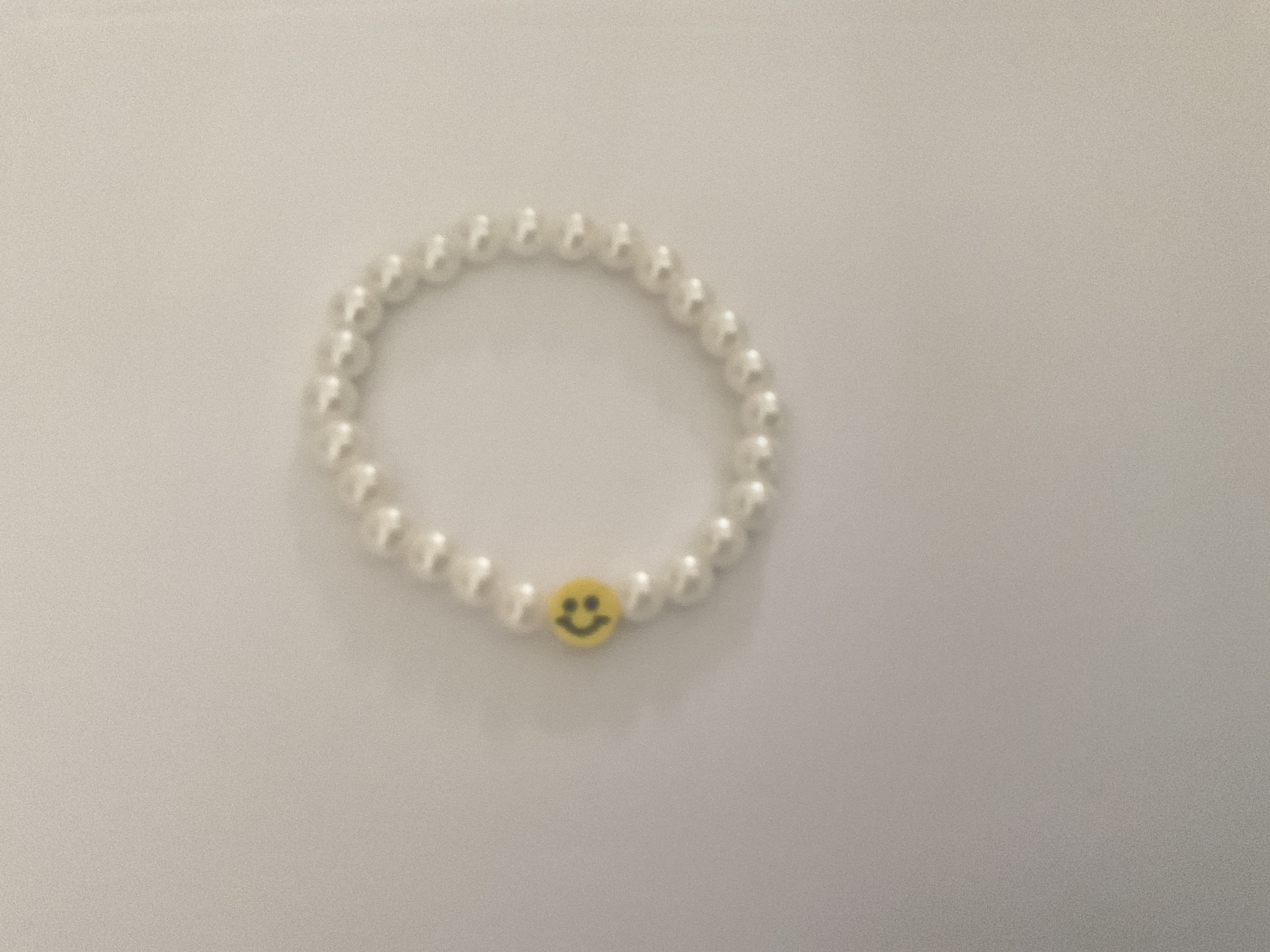 Smiley pearls bracelet