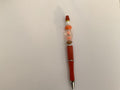 Orange beaded pen